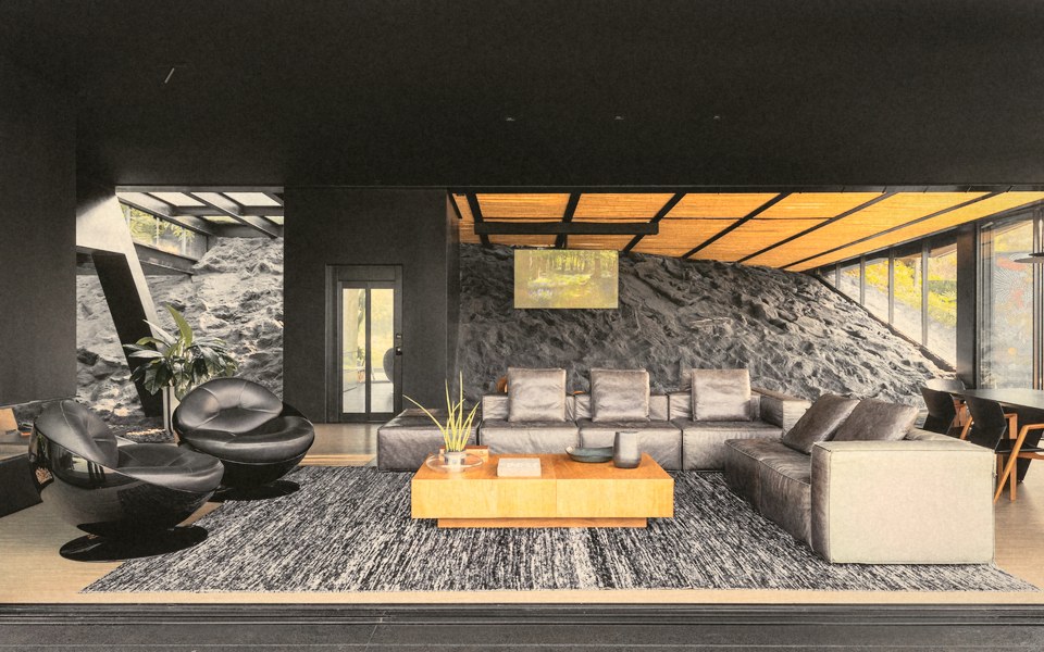 Uma sala com uma parede de rocha atrás do sofá